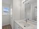 Bright bathroom features a modern vanity with a white countertop and updated fixtures at 3527 Crestridge Dr, Charlotte, NC 28217