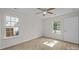 Bedroom boasts wood floors, two windows, and ample natural light at 3527 Crestridge Dr, Charlotte, NC 28217