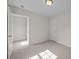 Bedroom features neutral carpet, white trim, and ample space at 3527 Crestridge Dr, Charlotte, NC 28217