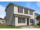 Well-maintained two-story house with light yellow siding, black shutters, and a neat exterior at 3527 Crestridge Dr, Charlotte, NC 28217
