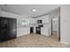 Spacious kitchen with modern appliances, white cabinetry, and hardwood floors, perfect for cooking at 3527 Crestridge Dr, Charlotte, NC 28217