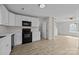 Bright kitchen features white cabinets, black appliances, hardwood floors, and an open layout at 3527 Crestridge Dr, Charlotte, NC 28217