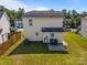 A shot of the back of the property, showing the yard, patio, and rear facade on a sunny day at 3527 Crestridge Dr, Charlotte, NC 28217