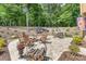 Landscaped backyard with patio, firepit and outdoor furniture at 4005 Capullo Ct, Matthews, NC 28104