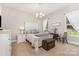 Well-lit bedroom with a vintage chest, neutral carpet, and a cozy bed at 4005 Capullo Ct, Matthews, NC 28104