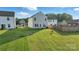 Large backyard with well-maintained green grass and a privacy fence at 4013 Southern Pine Dr, Mount Holly, NC 28120