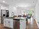 Open kitchen with stainless steel appliances and a connected dining area at 4013 Southern Pine Dr, Mount Holly, NC 28120
