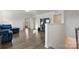 Cozy living room with hardwood floors and view into another room at 4013 Southern Pine Dr, Mount Holly, NC 28120