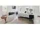 Bright main bedroom features a modern design with hardwood floors, two windows, and an adjoining bathroom at 4013 Southern Pine Dr, Mount Holly, NC 28120