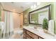 Green-walled bathroom featuring a shower/tub combo and vanity with decor at 4075 Crepe Ridge Dr, Denver, NC 28037