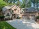 Charming two-story brick home with a spacious driveway and well-manicured lawn at 4075 Crepe Ridge Dr, Denver, NC 28037