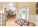 Elegant foyer with hardwood floors, a decorative front door, and a glimpse into the dining room at 4075 Crepe Ridge Dr, Denver, NC 28037