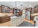 Spacious kitchen with stainless steel appliances, custom cabinetry, and a large island with white countertop at 4075 Crepe Ridge Dr, Denver, NC 28037