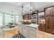 Open kitchen with an island, stainless steel appliances, custom cabinets and a breakfast area at 4075 Crepe Ridge Dr, Denver, NC 28037