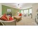 Comfortable living space with vibrant green walls, and a bright sitting nook at 4075 Crepe Ridge Dr, Denver, NC 28037