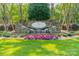 Community entrance sign for Sailview with stone architecture, a waterfall feature, and vibrant flower beds at 4075 Crepe Ridge Dr, Denver, NC 28037
