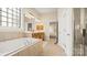 Bright bathroom showcasing soaking tub, double vanities, and natural light at 4115 Birkshire Hts, Fort Mill, SC 29708