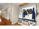 Hallway entrance featuring white shelving, dark wood bench top, wicker baskets and wood floors at 4115 Birkshire Hts, Fort Mill, SC 29708