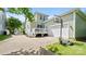 Light green two-story home with a white deck, white garage door and a basketball hoop on the driveway at 4115 Birkshire Hts, Fort Mill, SC 29708