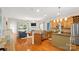 Open-concept kitchen and living room with hardwood floors and stainless steel appliances at 4115 Birkshire Hts, Fort Mill, SC 29708