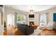 Comfortable living room with fireplace, hardwood floors, and natural light at 4115 Birkshire Hts, Fort Mill, SC 29708