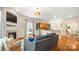 Inviting living room with hardwood floors, fireplace, and open layout to the kitchen at 4115 Birkshire Hts, Fort Mill, SC 29708