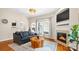 Cozy living room with fireplace, hardwood floors, and comfortable seating at 4115 Birkshire Hts, Fort Mill, SC 29708