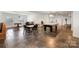 Finished basement with slate floors includes pool table and exercise equipment, perfect for entertaining at 4201 Amber Leigh Way Dr, Charlotte, NC 28269