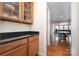 Convenient butler's pantry with granite counters and glass-front cabinets at 4201 Amber Leigh Way Dr, Charlotte, NC 28269