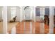 Elegant foyer featuring hardwood floors, decorative pillars, and abundant natural light at 4201 Amber Leigh Way Dr, Charlotte, NC 28269