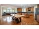 Spacious kitchen with wood cabinetry, a central island, and plenty of natural light at 4201 Amber Leigh Way Dr, Charlotte, NC 28269