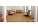 Cozy living room featuring carpeted floors, comfortable sofas, and large windows at 4201 Amber Leigh Way Dr, Charlotte, NC 28269