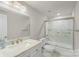 Bathroom featuring a marble topped vanity and marble tiled shower with a glass door at 4410 Burgin St, Kannapolis, NC 28081