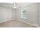 Neutral bedroom with carpet flooring, a ceiling fan, and a bright window at 4410 Burgin St, Kannapolis, NC 28081