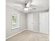 Clean bedroom featuring a ceiling fan and a window at 4410 Burgin St, Kannapolis, NC 28081
