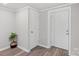 Bright entryway with a white door, a closet, and wood-look flooring, creating a clean and welcoming space at 4410 Burgin St, Kannapolis, NC 28081