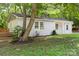 Charming home featuring a combination of brick and siding, complemented by mature trees and a well-maintained lawn at 4410 Burgin St, Kannapolis, NC 28081