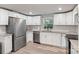 Bright kitchen with stainless steel appliances, granite countertops, and white subway tile backsplash at 4410 Burgin St, Kannapolis, NC 28081