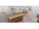 Open-concept living area featuring modern decor, a comfortable sofa, and a view into the kitchen and dining area at 4410 Burgin St, Kannapolis, NC 28081