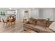 Open-concept living space with a cozy sofa, dining area, and connection to a modern, bright kitchen at 4410 Burgin St, Kannapolis, NC 28081