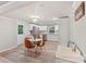 Bright and airy living space with a dining table, chairs, and access to the updated kitchen at 4410 Burgin St, Kannapolis, NC 28081