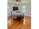 Hardwood-floored bedroom featuring a full-sized bed, natural lighting, and a ceiling fan for relaxed comfort and style at 4421 Linwood Rd, Gastonia, NC 28052