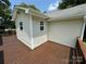 A charming home shows off its lovely stained wood deck, perfect for outdoor entertaining at 4421 Linwood Rd, Gastonia, NC 28052