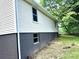 A section of the house has been painted a cool gray to complement the home's classic cream siding at 4421 Linwood Rd, Gastonia, NC 28052