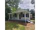 Inviting exterior of a well-maintained home with a spacious front porch at 4421 Linwood Rd, Gastonia, NC 28052