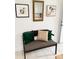 Hallway bench with art and opening to kitchen area at 4421 Linwood Rd, Gastonia, NC 28052