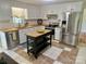 Bright kitchen featuring white cabinets, butcher block countertops, and stainless steel appliances at 4421 Linwood Rd, Gastonia, NC 28052