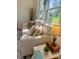 Cozy living area with a comfortable sofa, accent pillows, and natural light at 4421 Linwood Rd, Gastonia, NC 28052