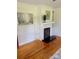 Living room featuring hardwood floors, fire place, and white trim at 4421 Linwood Rd, Gastonia, NC 28052