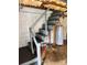 Basement stairway, with painted wood steps and railing, leading to the lower level of the home at 4421 Linwood Rd, Gastonia, NC 28052